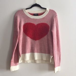 Red and white sweater with fuzzy heart.